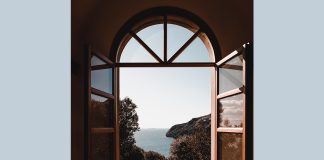 window overlooking sea - photo by Alessio Cesario on Pexels