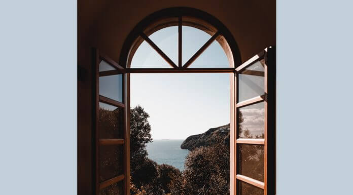 window overlooking sea - photo by Alessio Cesario on Pexels