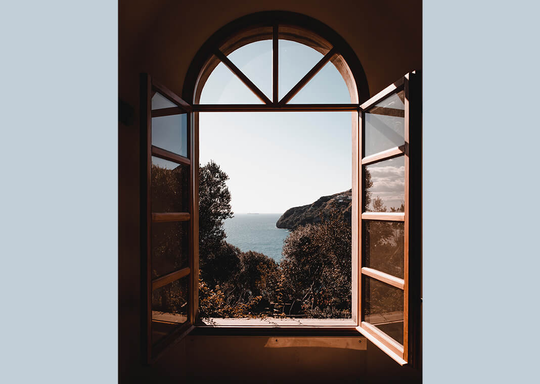 window overlooking sea - photo by Alessio Cesario on Pexels