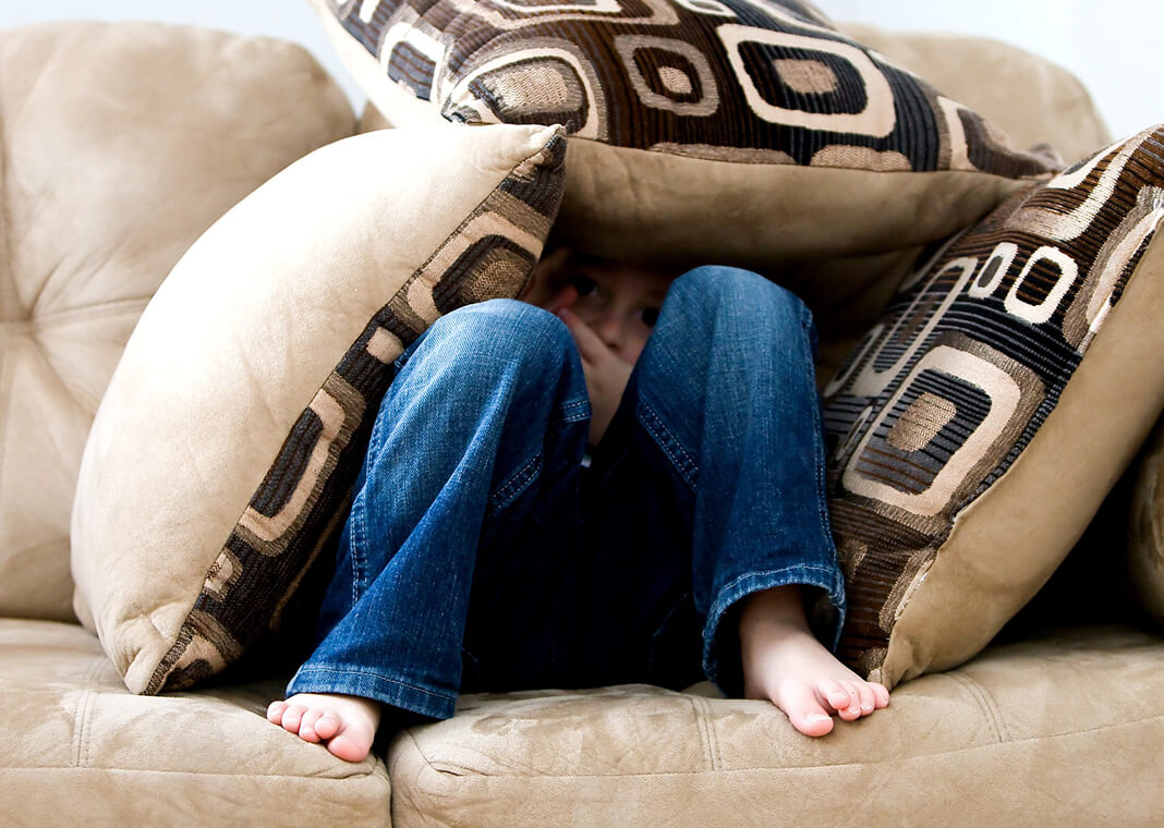 child hiding under pillows - image by ambermb from Pixabay