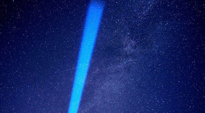 beam of blue light in night sky - image by torstensimon from Pixabay