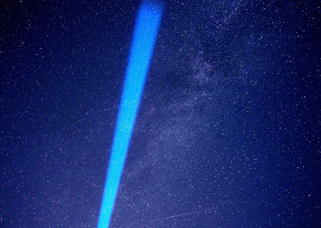beam of blue light in night sky - image by torstensimon from Pixabay