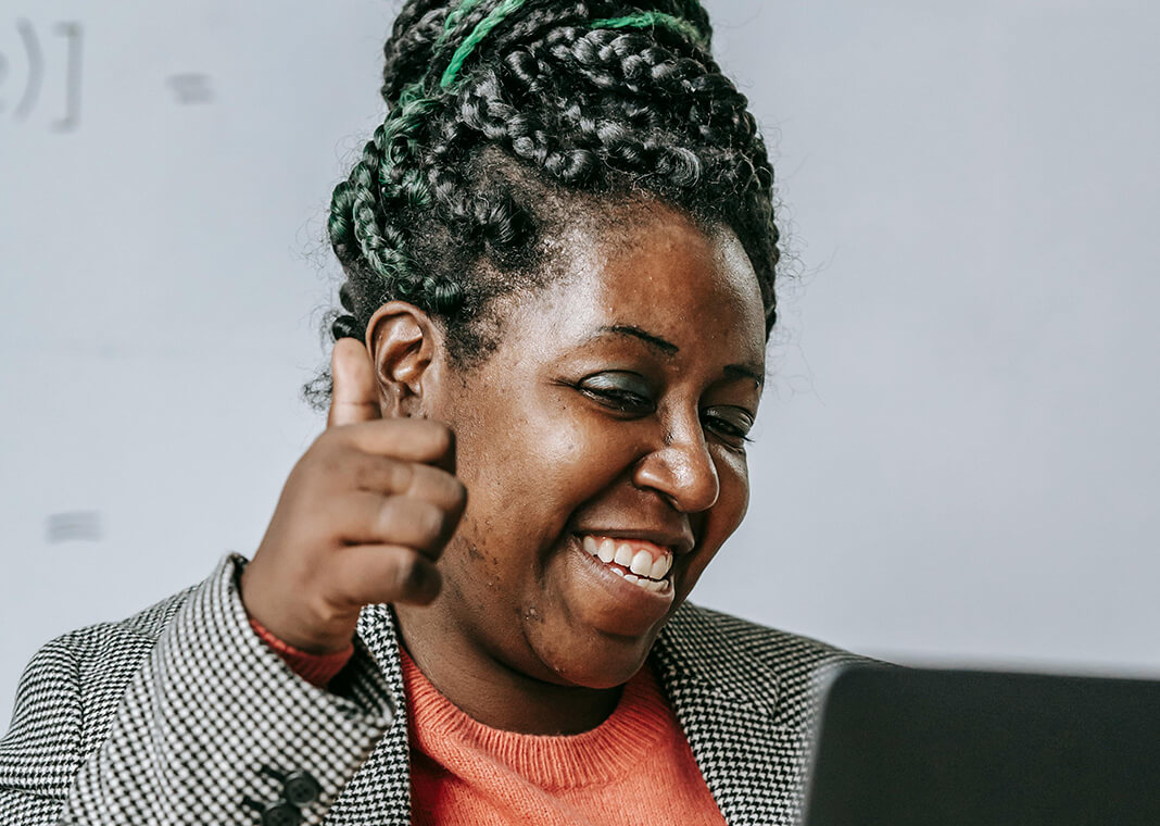 confident woman giving thumbs up - photo by Katerina Holmes via Pexels