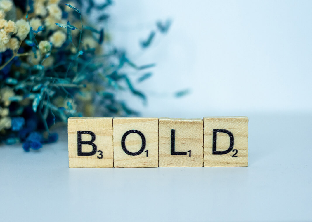 letter tiles spelling out "bold" - photo by Alex Shute on Unsplash