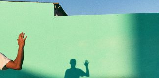shadow of waving man - photo by Ioana Cristiana on Unsplash