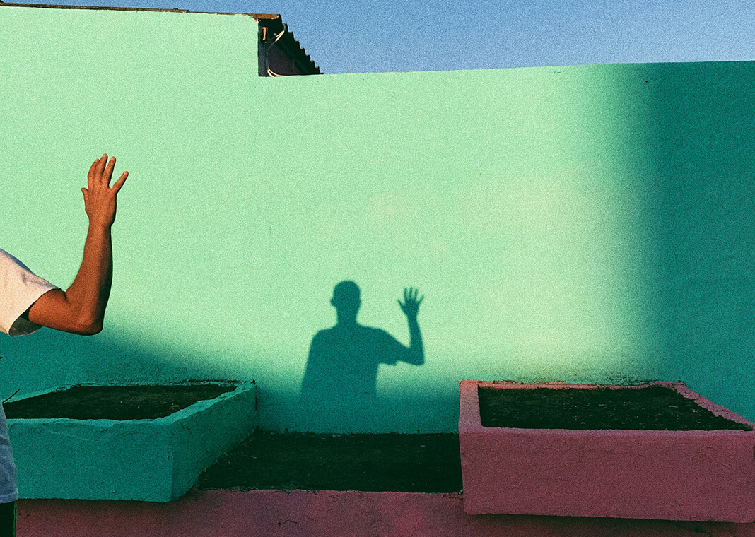 shadow of waving man - photo by Ioana Cristiana on Unsplash