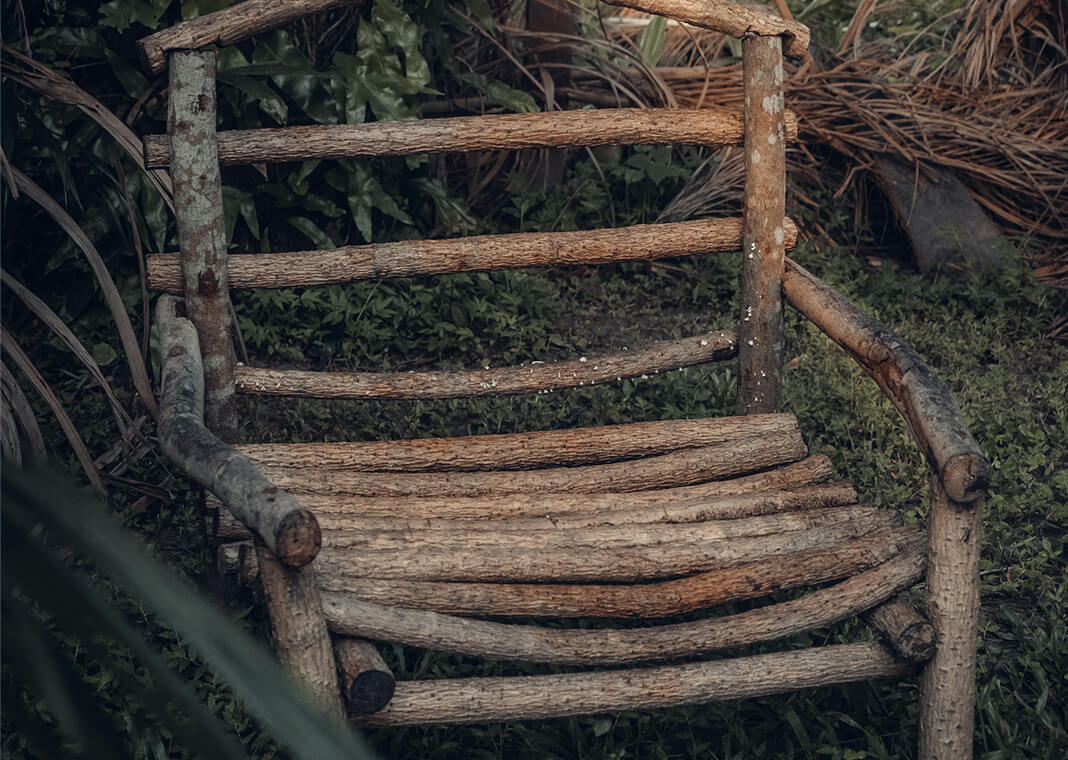wooden chair in forest - photo by Abdul Azeez Garbadeen on Unsplash 