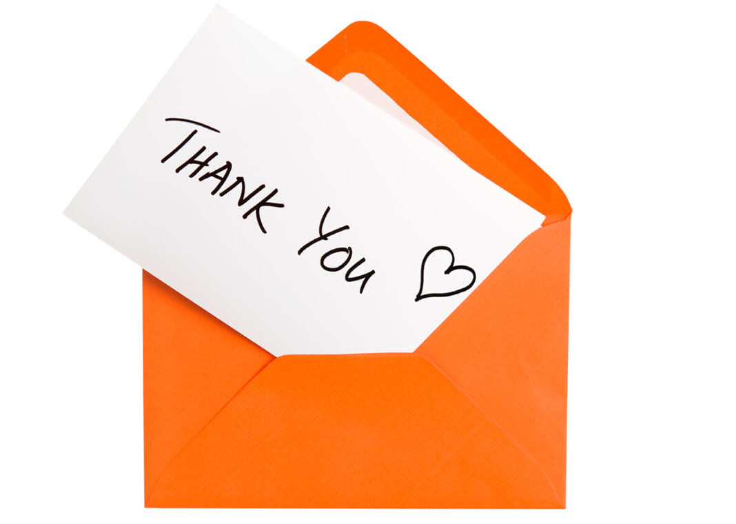 thank you note in orange envelope - Photoevent/E+/Getty Images
