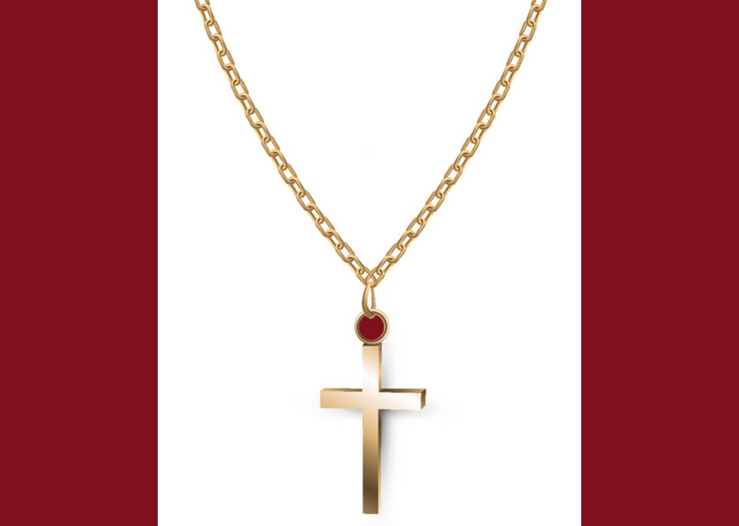 gold cross on chain against white background - Lidiia Moor/iStock/Getty Images - burgundy color accents added