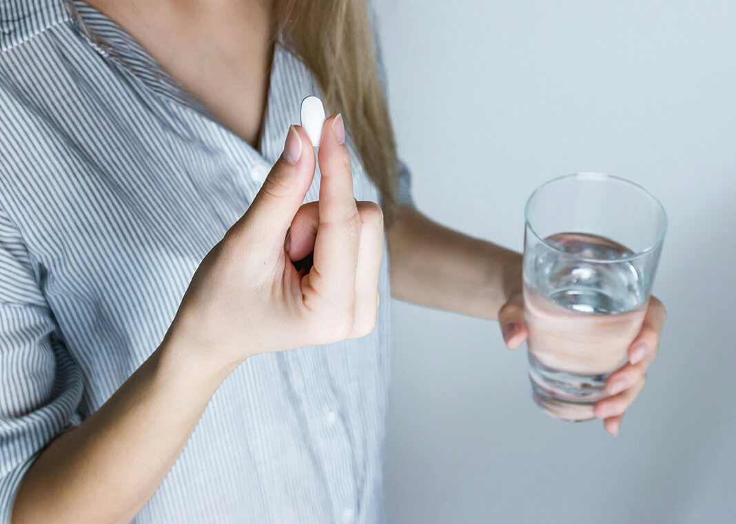 woman taking medicine - photo by JESHOOTS.com via pexels.com