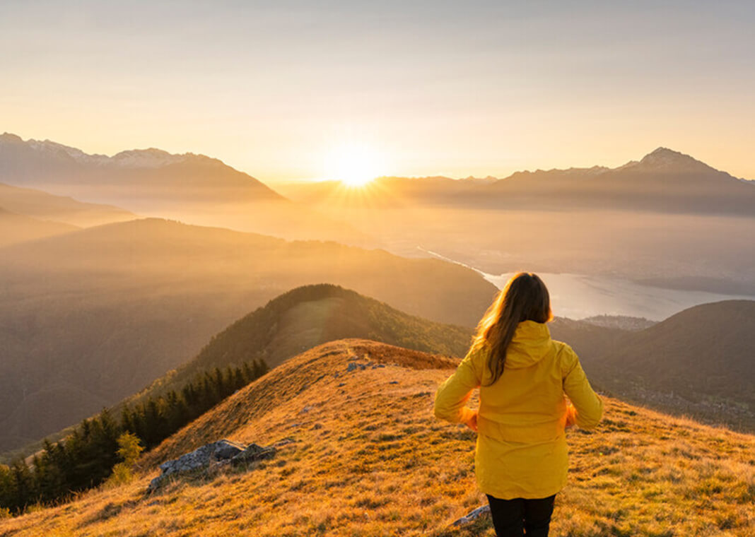 woman gazing at mountains - Francesco Vaninetti Photo/Moment/Getty Images