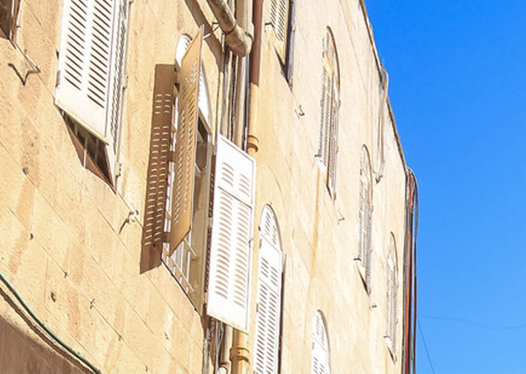 window shutters on old building - © Shelly Bychowski at iStock/Getty Images