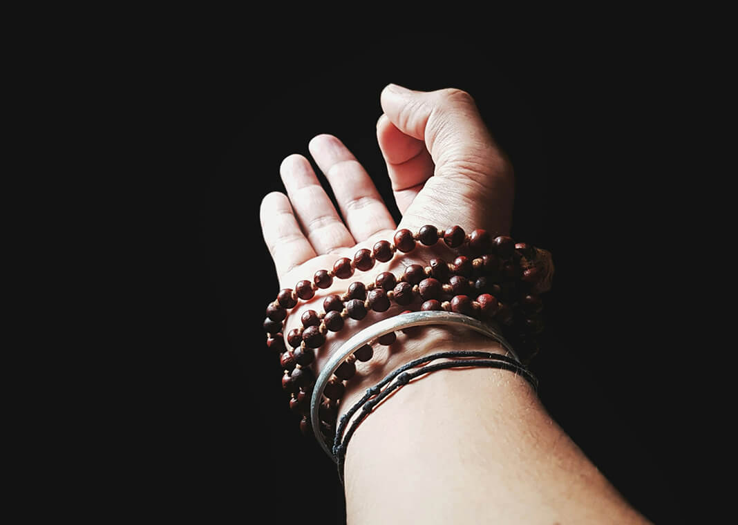 thumb and index fingers pressing together - photo by Vinit Vispute on Unsplash