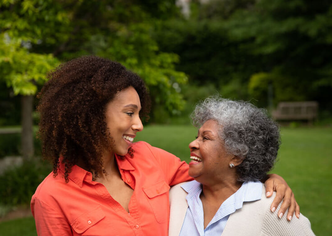 adult daughter smiling at her mother - wavebreakmedia/Shutterstock.com