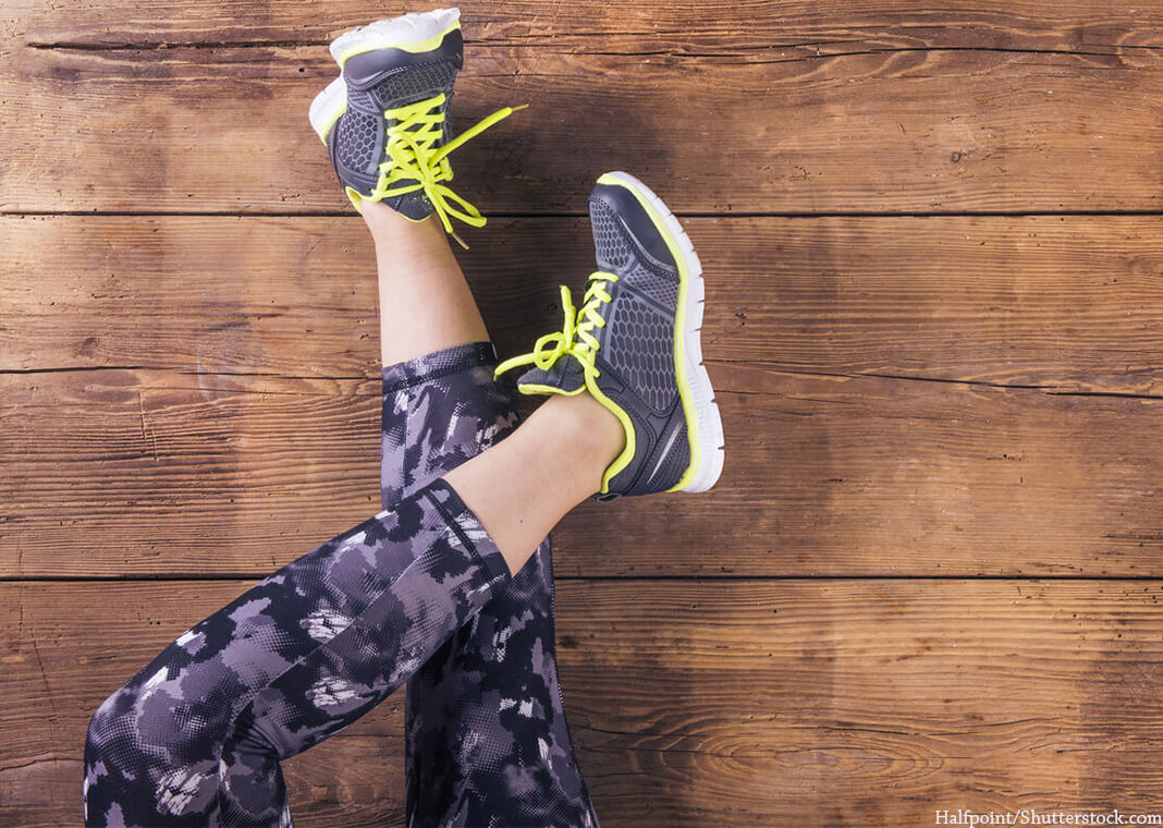 runner in purple pants at rest as seen from above - Halfpoint/Shutterstock.com